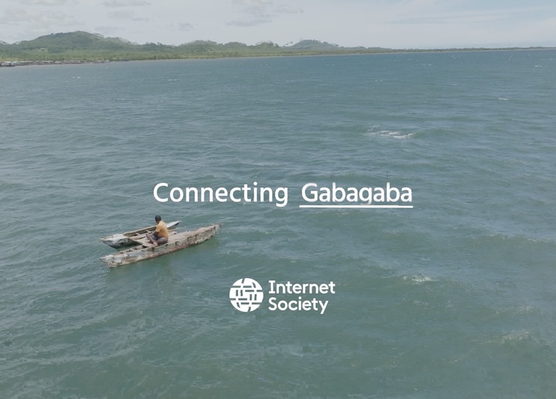 A man sits on a boat in a large body of water. Text reads: Connecting Gabagaba.