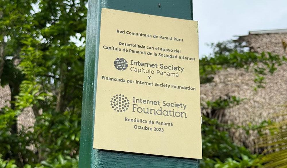 A sign on a community network with the logos of the Internet Society Panama Chapter and the Internet Society Foundation